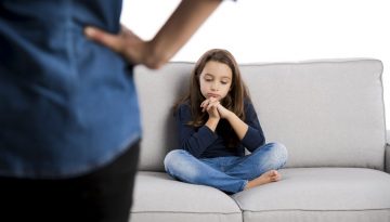 59702301 - grown up rebuking a little child for bad behavior